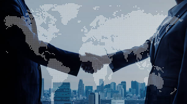Business handshake over a global map representing professional affiliations